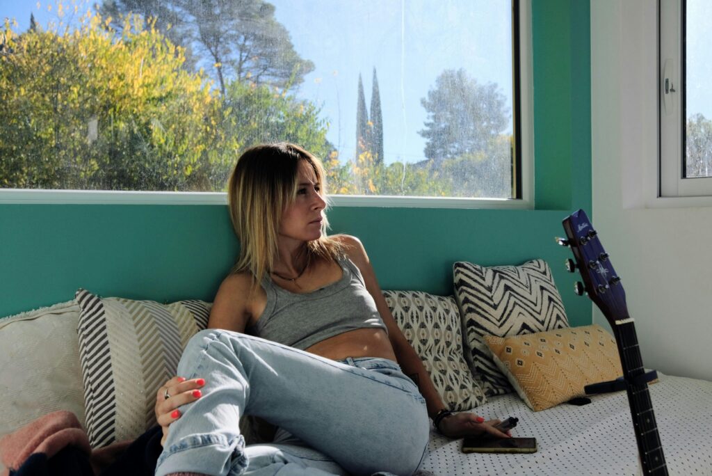 couple facing away from each other looking stressed, relationship tension, emotional distance, professional photography, muted colors